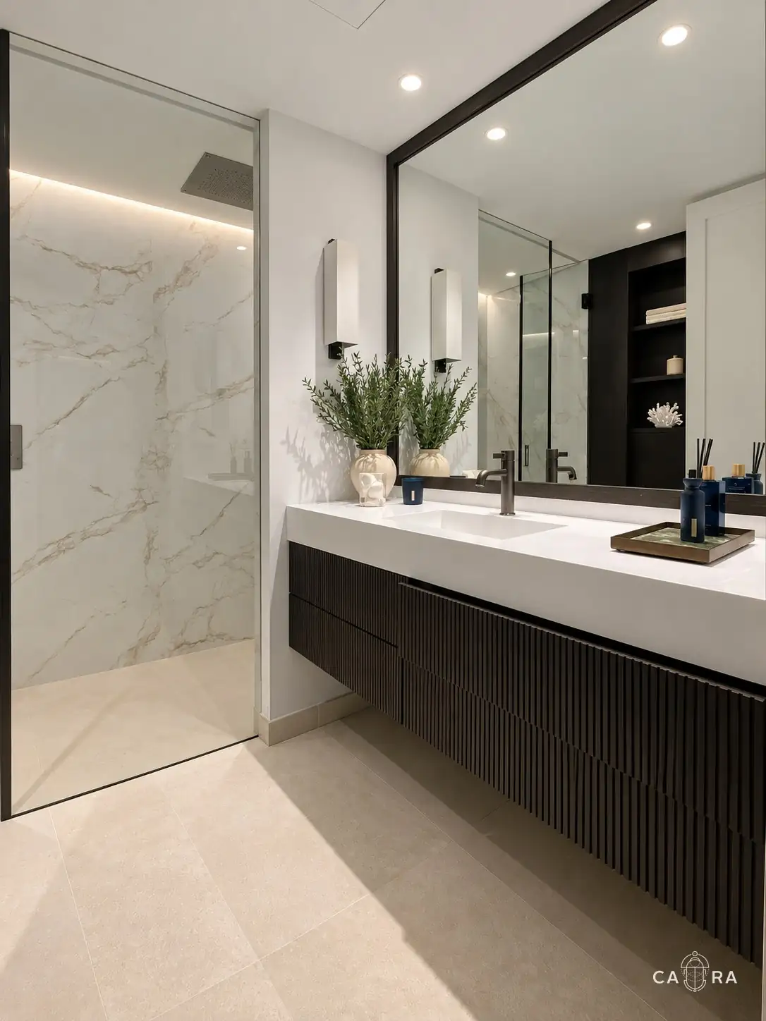 Bathroom with fluted dark wood vanity, white top and walk-in marble shower