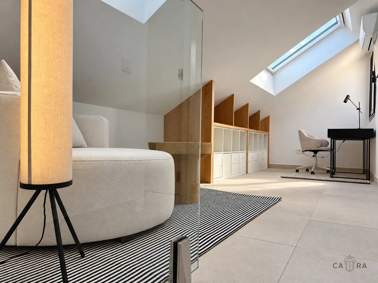 Loft with bespoke oak shelving under the sloping roof