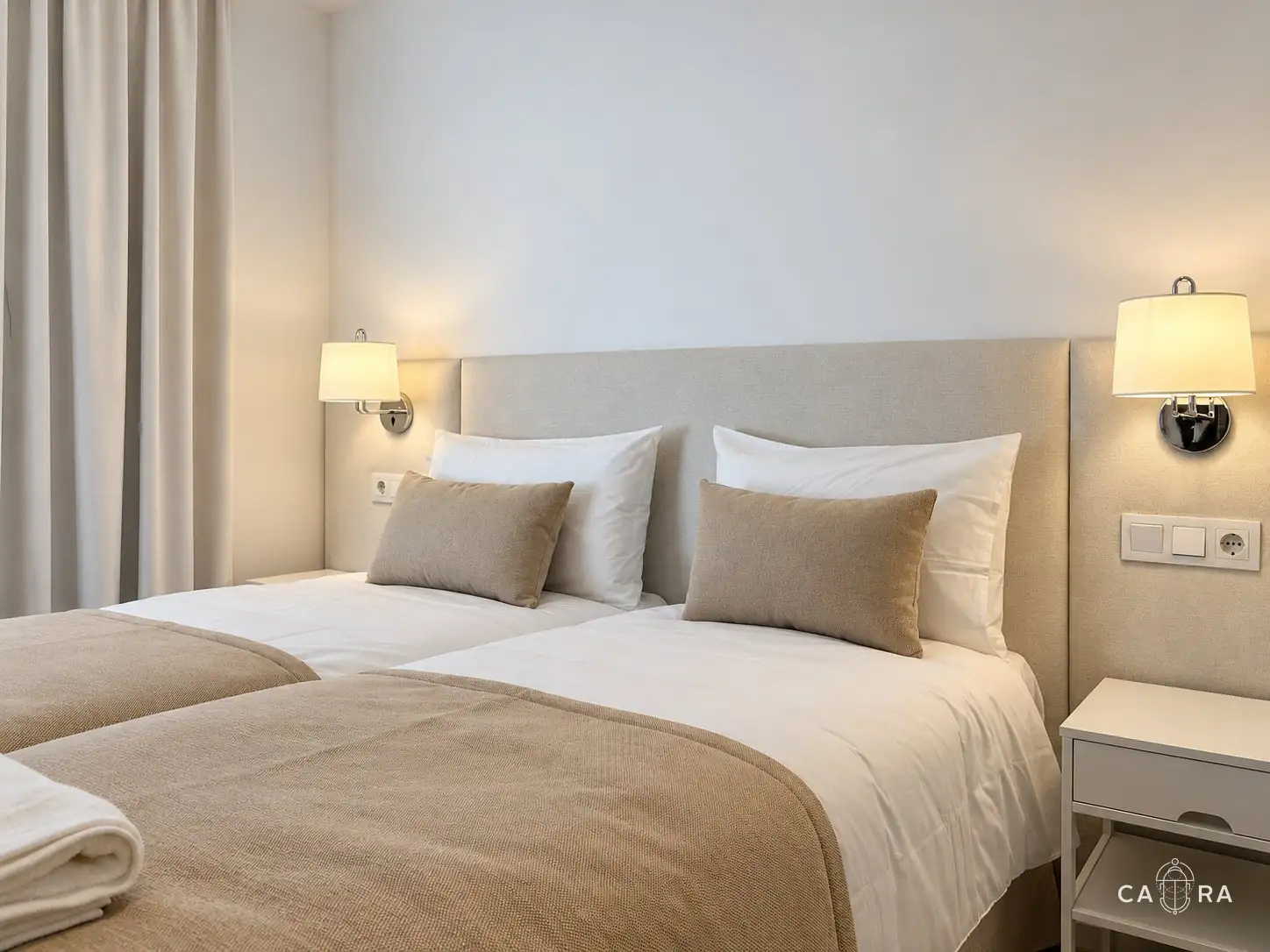 Twin bedroom in sand tones with curtains