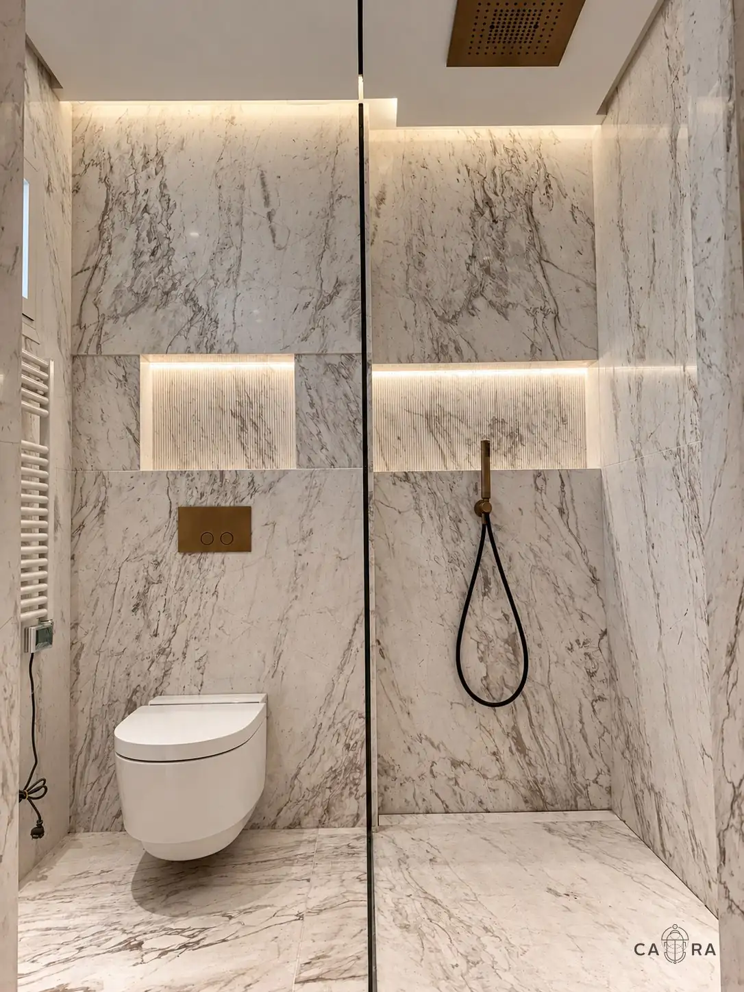 Guest bathroom clad in veined white marble